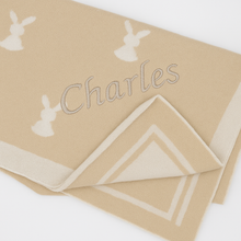 Load image into Gallery viewer, Close-up of embroidery on beige personalised baby blanket – Little Rabbits