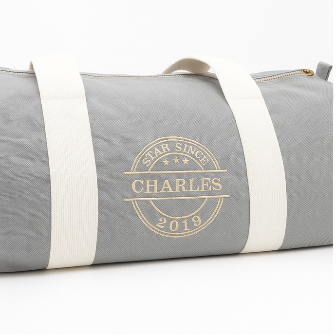 Personalised grey barrel bag with embroidered name – Star Since design
